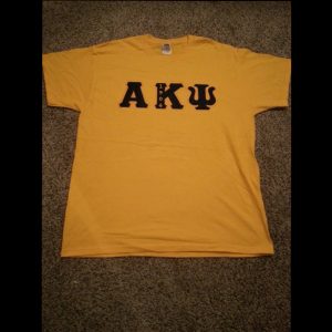 Alpha Kappa Psi Gold Shirt With Navy Letters
